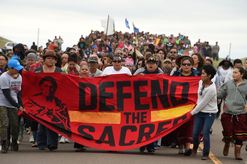 Native Americans march to the site of a sacred burial ground that was disturbed by bulldozers building the Dakota Access Pipeline, near the encampment where hundreds of people have gathered to join the Standing Rock Sioux tribe's protest of the oil pipeline, on Sept. 4, 2016, near Cannon Ball, N.D.Robyn Beck/AFP/Getty Images